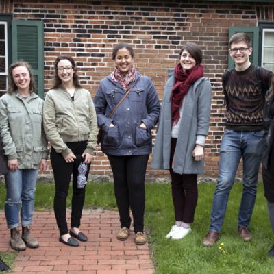 Students stand with their professor outside of the Fort York kitchen