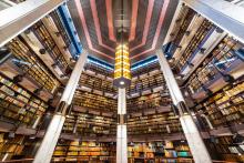 Mezzanine stacks of books inside the Fisher Library